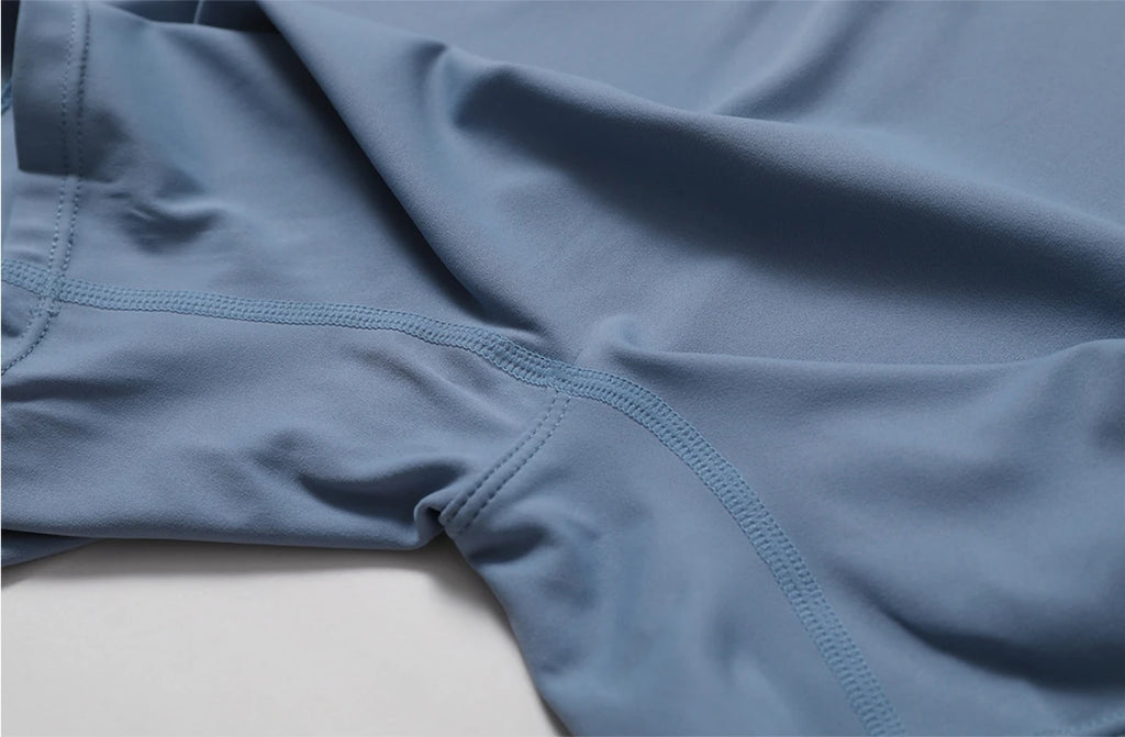 Combinaison de yoga une pièce européenne et américaine nude avec col montant, demi-fermeture éclair, combinaison de fitness à manches courtes, coupe ajustée